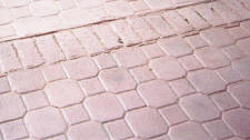 Cobble Paver Stamped Concrete with Old Brick Soldier Course Stamped Border